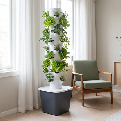 The planted tower beside an armchair by a window, showing its real size in a room